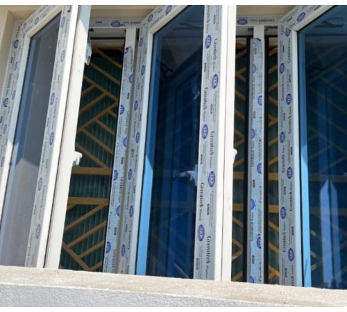 White openable UPVC window installation