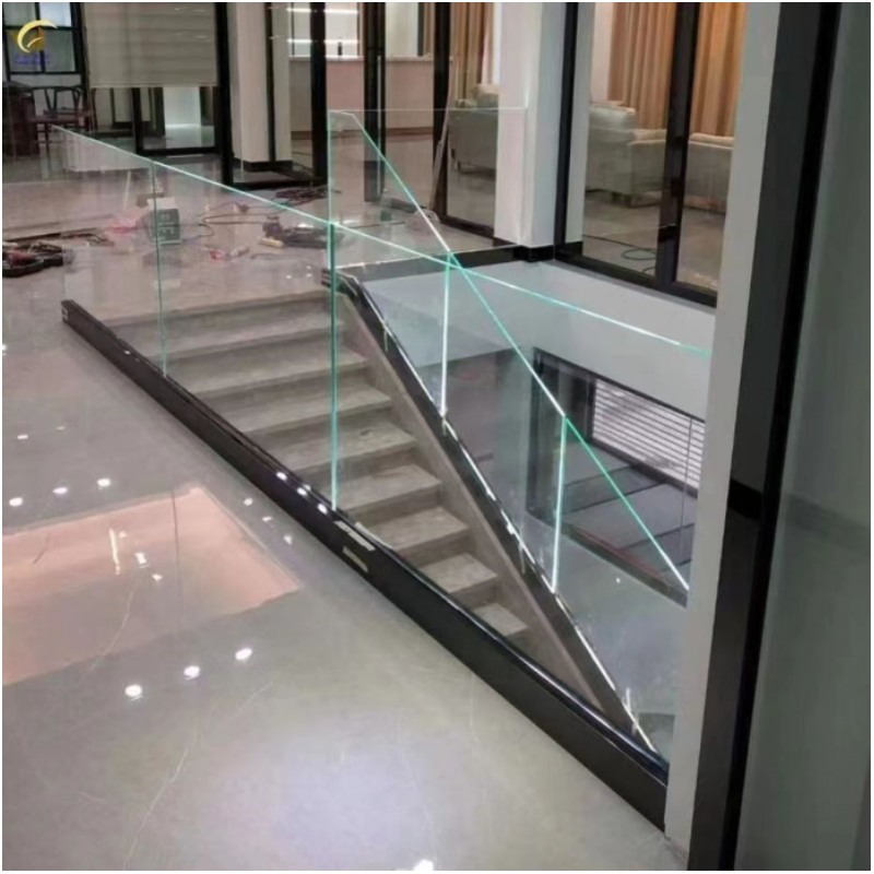Toughened glass balustrade fixed in a black aluminium profile